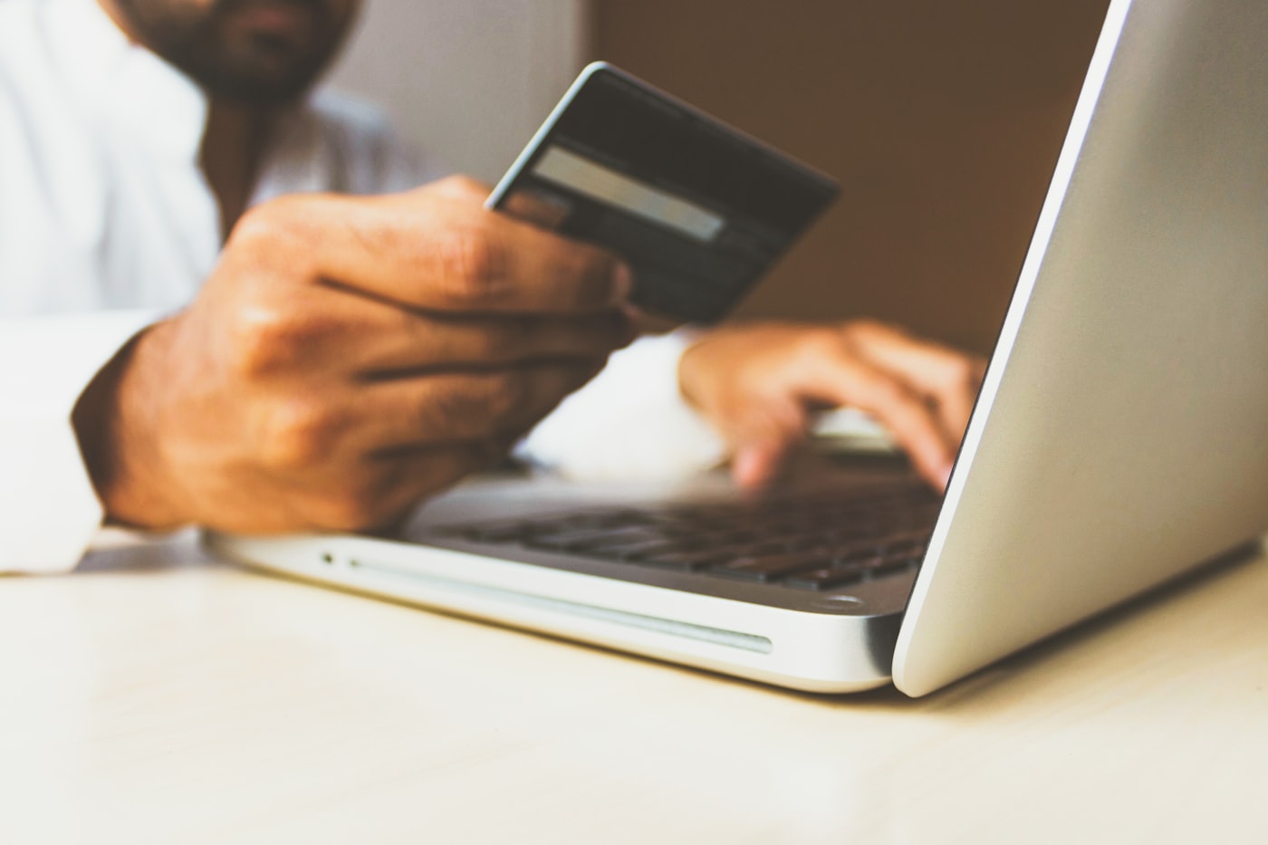 Shopify store owner reviewing performance on laptop
