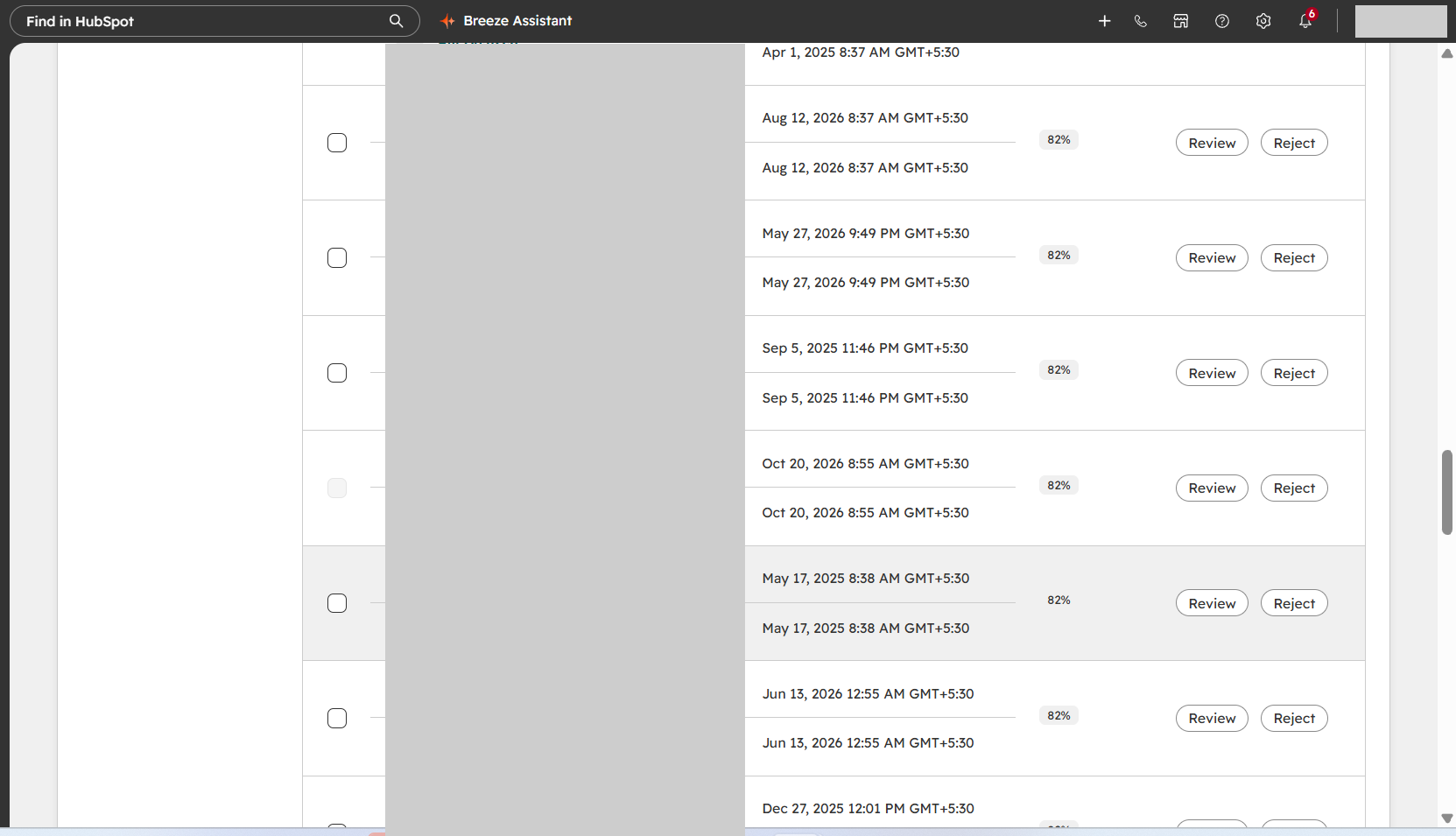 Redacted HubSpot contact duplicate-review interface showing pair review and reject controls